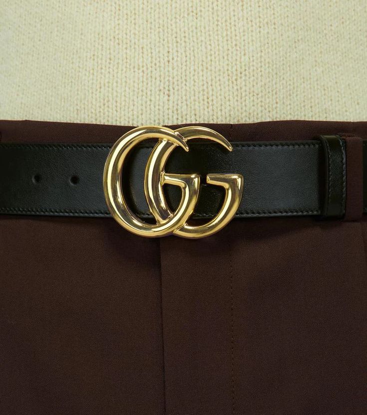 Crafted in Italy from leather, this black belt from Gucci features the label's double G buckle logo in gold, this style comes with punch holes for an adjustable fit..Color of fastening: gold.Made in Italy.Material: calf leather.Width 4cm-1.5' Formal Black Belt With Metal Logo, Black Belt With Metal Logo, Classic Black Belt With Metal Logo, Designer Black Belts With Metal Logo, Designer Black Belt With Metal Logo, Leather Belt With Gold-tone Logo For Business, Designer Belts With Metal Logo For Business, Designer Black Belts With Gold-tone Logo Plaque, Formal Black Belt Buckles With Gold-tone Logo