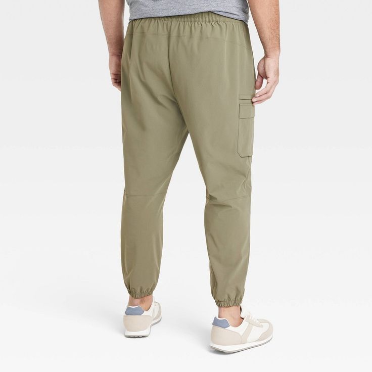 Why we're ALL IN: Solid-hued cargo jogger pants made from quick-dry fabric with moisture-wicking properties to help keep you cool and dry during a range of activities. Designed in a tapered-leg silhouette with elastic at the leg openings for a snug, stay-put fit. Side zipper pockets and side cargo pockets complete the look with functional flair. All in Motion™: Made for every move, priced for every day. Green Joggers With Pockets For Outdoor Activities, Green Athleisure Cargo Pants For Outdoor Activities, Green Athleisure Cargo Pants For Outdoor, Green Cargo Pocket Joggers For Outdoor, Sporty Green Joggers For Outdoor Activities, Outdoor Sportswear Sweatpants With Cargo Pockets, Khaki Athleisure Bottoms For Outdoor, Green Outdoor Joggers With Side Pockets, Green Joggers With Side Pockets For Outdoor