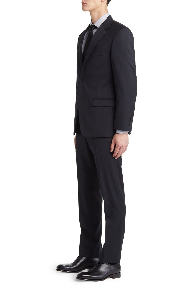 Notched lapels and classic pockets add dapper polish to a suit tailored from rich wool and styled for versatility in classic, all-occasion black. Front button closure Jacket has notched lapels; chest pocket; flap pockets Trousers have zip fly with hook-and-bar closure; slant pockets; back button-welt pockets Jacket is lined 100% wool Dry clean Imported Classic Suits With Welt Pockets And Suit Collar, Classic Notch Lapel Suits For Work, Classic Tailored Suits For Formal Occasions, Classic Wool Suit For Work, Classic Wool Suits For Work, Classic Three-piece Suit With Notch Lapel For Formal Events, Classic Three-piece Suit With Notch Lapel For Formal Occasions, Classic Tailored Suit And Tie Accessories For Formal Occasions, Classic Business Casual Suits With Single Button