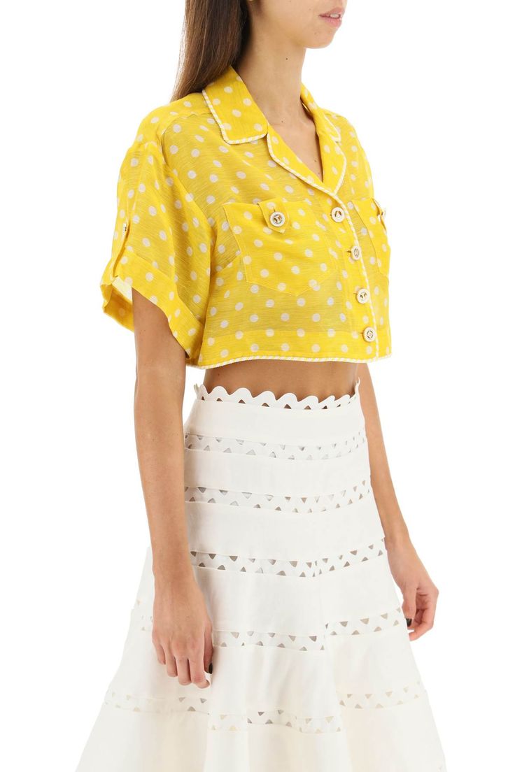 Short-sleeved shirt by Zimmermann made of polka dot linen and silk organza with a cropped boxy fit. It features a camp collar, two chest pockets and turn-up cuffs, and is finished with decorative tabs, nautical-style buttons and two-tone cord trims. Unlined. The model is 177 cm tall and wears a size 1 Zimmermann. Size Info STANDARD Color Detail Yellow Made In China Material 53% LI 47% SE Season One spring Season Two summer Product clothing Brand Zimmermann Size And Fit Fitted Collared Cropped Shirt For Summer, Fitted Cropped Shirt For Summer Daywear, Summer Cropped Shirt With Buttons For Daywear, Chic Collared Crop Top For Summer, Spring Cropped Blouse With Button Cuffs, Buttoned Cropped Shirt For Summer, Summer Cropped Shirt With Buttons, Cropped Buttoned Shirt For Summer, Short Sleeve Crop Top With Button Closure For Summer