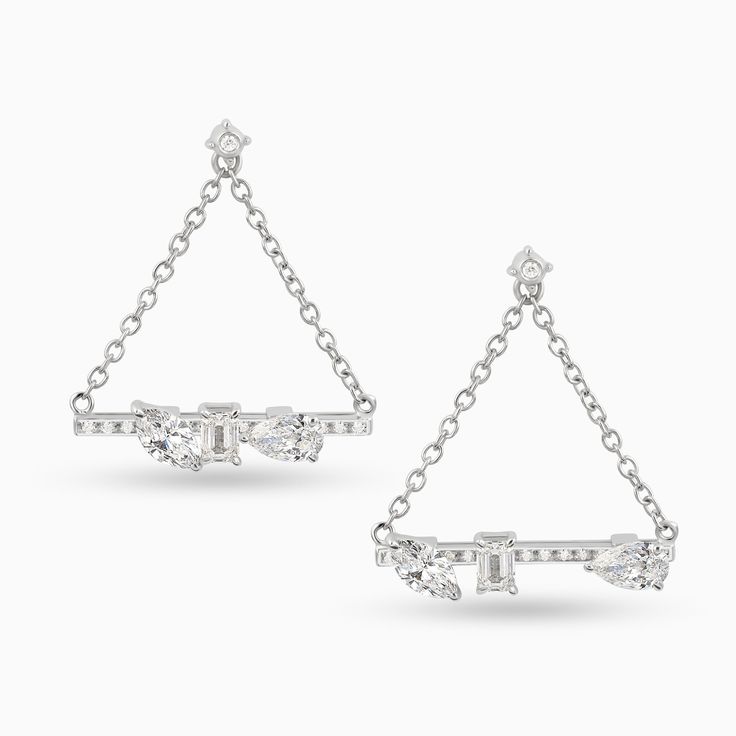 Get into the swing with these acrobatic earrings with brilliant diamonds that slide back and forth on a line of sparkling diamond pave. Here’s to a brilliant past, present and future. Diamond Weight: 1.63 ct Color: G-H Clarity: VS-SI Gold Quality: 18kt Sterling Silver Earrings With Single Cut Diamonds For Evening, Sterling Silver Single Cut Diamond Earrings For Evening, Fine Jewelry Linear Diamond Earrings With Single Cut, Single Cut Diamond Linear Earrings, Modern Sterling Silver Diamond Earrings For Evening, White Gold Diamond Earrings With Pave Setting For Party, White Gold Cubic Zirconia Linear Earrings, White Gold Earrings With Baguette Diamonds For Party, Gift Linear Earrings With Single Cut Diamonds