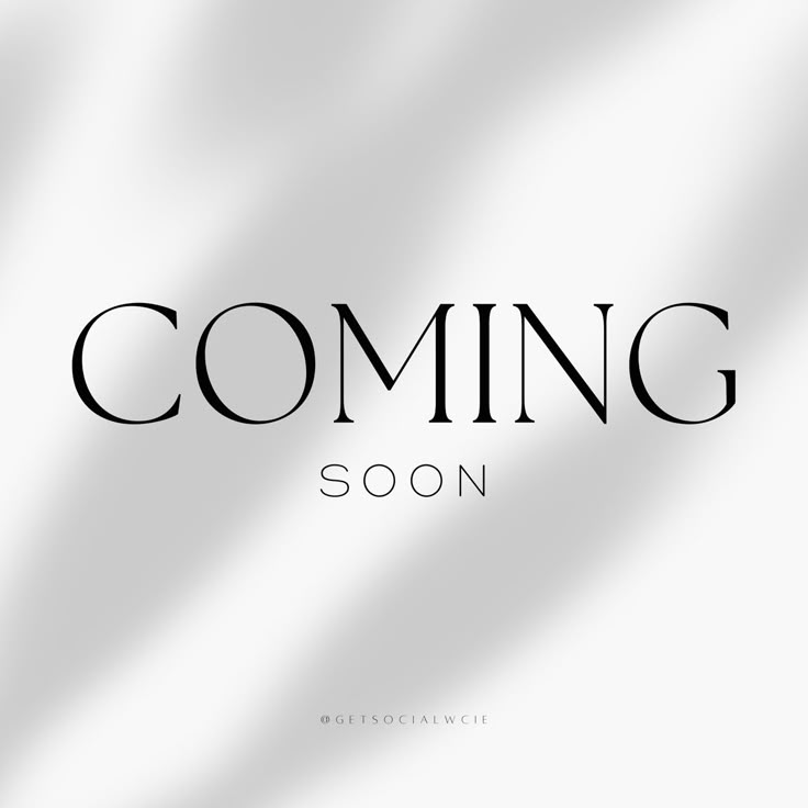 the words coming soon are shown in black on a white background with an elegant pattern