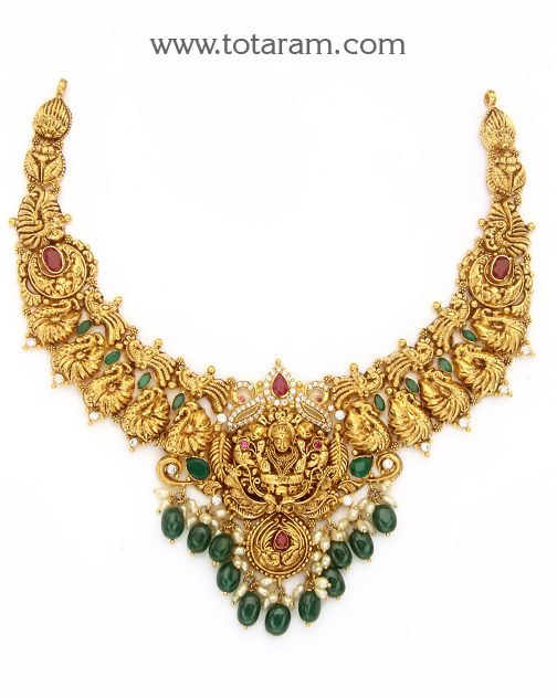 22 Karat Gold "Lakshmi - Peacock" Necklace with Cz, Color Stones, Beads & Pearls (Temple Jewellery)

Enhance Your Beauty with 22 Karat Gold "Lakshmi - Peacock" Necklace!    Indulge in the exquisite craftsmanship of Indian gold jewelry with this stunning 22 Karat Gold "Lakshmi - Peacock" Necklace from Totaram Jewelers. Adorned with sparkling CZ stones, colorful beads, and lustrous pearls, this temple jewelry piece is a true masterpiece that will elevate your style to new heights Luxury Temple Jewelry Pearl Necklace For Diwali, Luxury Bollywood Kundan Temple Necklace, Luxury Chandbali Necklace For Anniversary, Luxury Gold Kundan Necklace With Diamonds, Luxury Traditional Temple Necklace With Stone Work, Luxury Jeweled Temple Jewelry Necklaces, Luxury Gold Temple Necklace For Festive Occasion, Luxury Yellow Gold Kundan Necklace In Temple Style, Luxury Brass Temple Jewelry Necklace