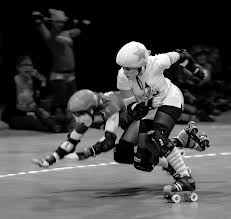 two people on roller skates going after each other