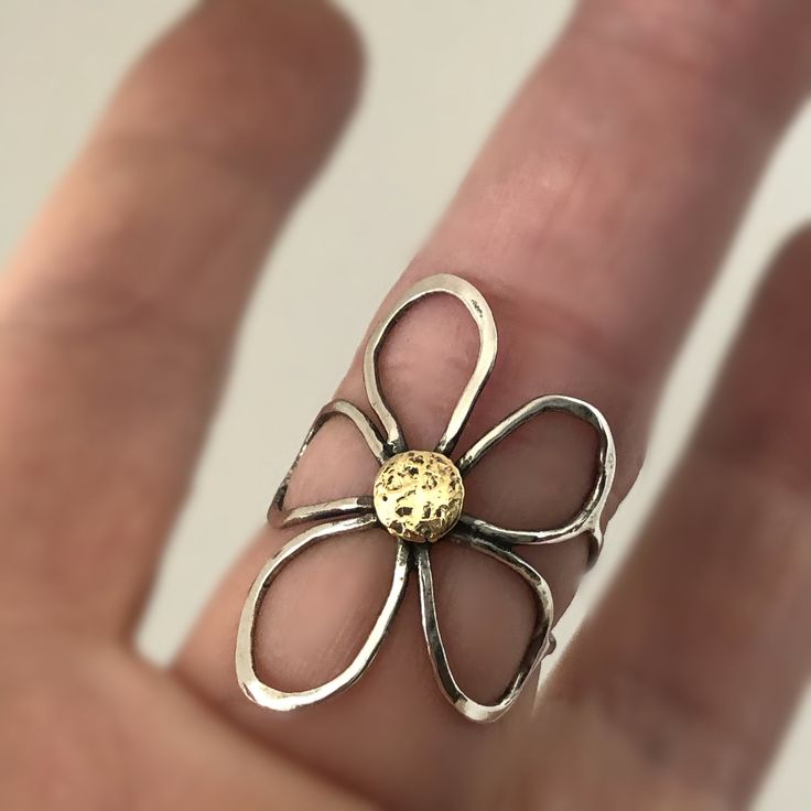 Fantastic handcrafted Sterling silver flower rings that are made to order in your size. They are handmade individually out of Sterling silver wire, oxidized for dimension and polished to high shine. These little pieces of art are relatively flat, mold around your finger and are see through, kind of like lace is. You will love this ring if you like big, handmade jewelry, that is comfortable to wear. These rings don't come from a mold. I make them individually out of wire. They are all very simila Nature-inspired Flower Shaped Ring As A Gift, Nature-inspired Flower Shaped Gift Ring, Unique Hand Forged Sterling Silver Rings, Handmade Gold Flower Ring, Nature-inspired, Handmade Yellow Gold Flower Promise Ring, Hand Forged Ring Jewelry For Gift, Hand Forged Ring Jewelry As Gift, Gold Sterling Silver Flower Ring Gift, Hand Forged Open Ring Jewelry For Gift