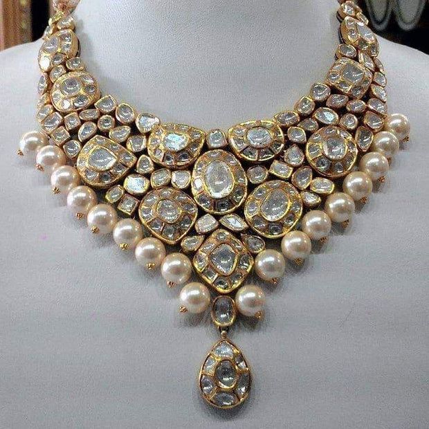 Luxury Heavy Kundan Necklaces, Luxury Bollywood Kundan Diamond Necklace, Luxury Bollywood Kundan Necklace For Puja, Luxury Kundan Statement Jewelry, Luxury Oxidized Kundan Necklace For Wedding, Luxury Temple Jewelry Style Choker With Cutdana, Luxury Dual-tone Gold Kundan Necklace, Luxury Kundan Necklace For Reception With Round Beads, Luxury Handmade Kundan Necklace