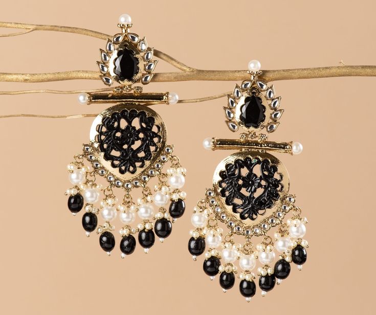 Our Indian earrings is Gold plated, & created with careful attention to detail. The color combination and finishing gives it an elegant look and feel. This design is perfect for parties & functions as these earring are specially designed for Indian beautiful brides -Base Metal- Alloy -Plating- Gold -Stone- Earrings & Mirrors -Sizing-Non Adjustable -Type- Chandbali Earrings -Light Weight -FREE Shipping -Gift Wrapping Available -Delivery from a Small Business in India -Handmade Product Skin Friendly- Lead & Nickel Free in compliance with all International Requirements. Gift- Ideal Valentine, Birthday, Anniversary gift for someone you Love/ Best Friend/Girlfriend. Occasion- Festivals, Wedding, Party Wear, Perfect For Indian weddings We tried to cover as many details as possible in our picture Black Metal Chandbali Earrings, Traditional Black Dangle Chandelier Earrings, Festive Black Metal Earrings, Traditional Black Drop Earrings Danglers, Traditional Black Chandelier Earrings Gift, Traditional Black Drop Earrings, Black Dangle Earrings For Festive Occasions, Elegant Black Jewelry With Latkans, Elegant Black Chandbali Jewelry