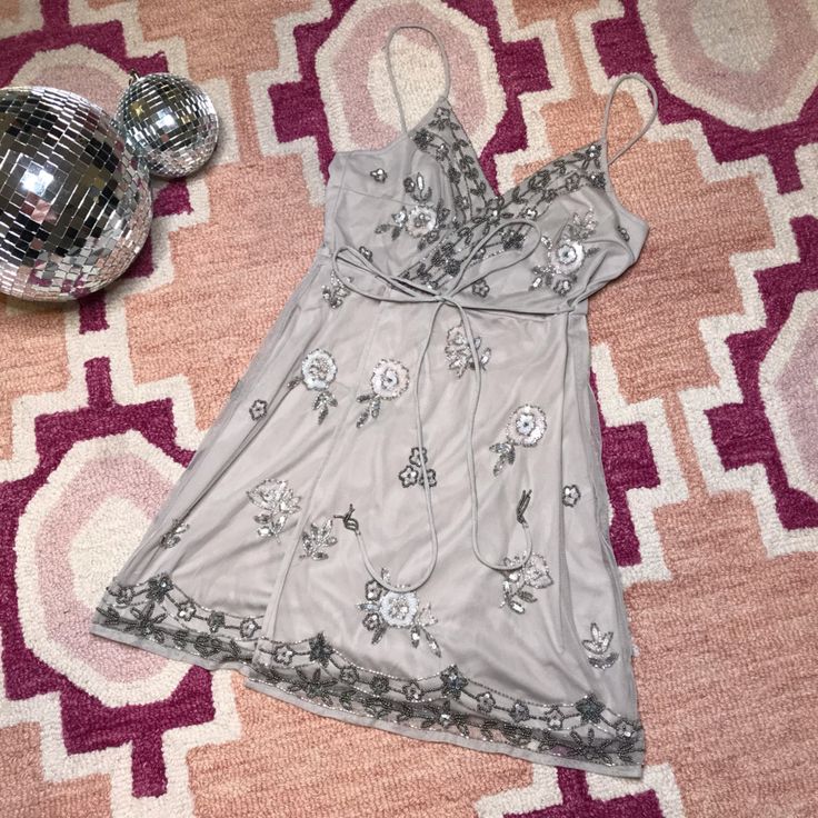 Brand Name/Market: Altard State Size: Extra Small Color: Grey Retail Price: $150 Condition: Nwt Always Make Sure To Wash The Clothing Before Wearing :) Make Sure To Follow Me On Instagram At @Whatwillcassiefind Silver Embellished V-neck Mini Dress, Spring V-neck Embellished Sequin Dress, Embellished Silver Sequin Dress For Date Night, Silver Embellished Sequin Dress For Date Night, Silver Sequin V-neck Dress For Spring, Glamorous Beaded Sequin Dress For Spring, Glamorous Spring Dress With Beaded Straps, Glamorous Beaded Spring Dress, Silver Sequin V-neck Dress For Summer