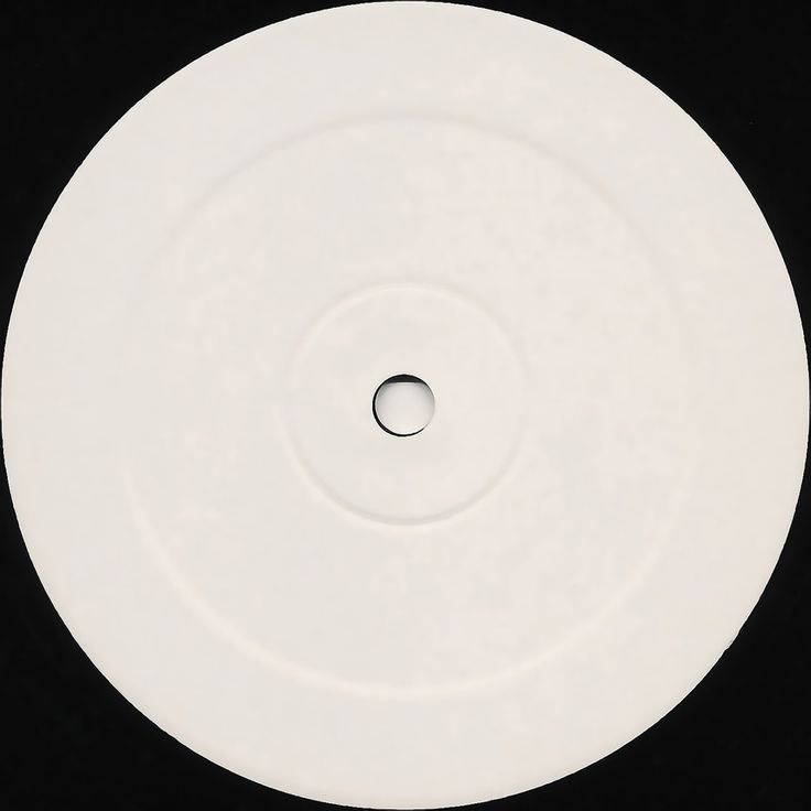 a white disc with a hole in the middle on a black background, showing an area for text