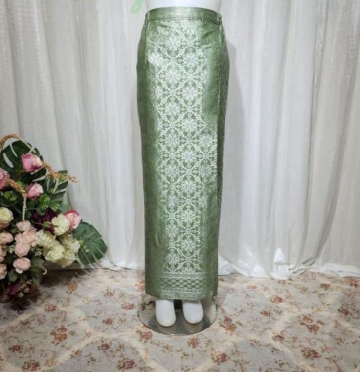 Beautiful luxury Sage Green - gold songket skirt, traditional woven songket from Palembang Indonesia. Songket means: traditional woven technique to produce fabric with non-machine and Palembang is famous for producing their ethnic traditional woven fabric. It's very fabulous wrap songket skirt that you can choose for your traditional wedding skirt, or you can choose to match with your beautiful kebaya, you can wear it with white, black, pale, yellow, gold, green,   or any color and  woven are very natural but glamours. We added strap at the right and left waist and it will be easier to wear and adjust, don't worry you can adjust with your body. and we have some size to you Material * Traditional woven songket Palembang *fiber: Cotton mix synthetic *Texture:Thick, heavy, embossed thread Sty Sage Green Kebaya, Traditional Green Skirt, Traditional Long Skirt For Eid, Traditional Fitted Green Skirt, Traditional Fitted Skirt For Eid, Sarong Skirt, Wedding Skirt, Sarong, Wrap Skirt