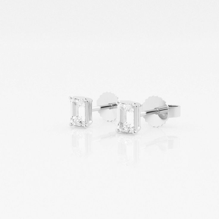 There's nothing more versatile than a pair of classic stud earrings. We love these princess cut lab grown diamond studs for every occasion, be it zoom meetings, brunch with friends or quiet evening dinner with your beau. Pick the size and color best suited to your ears in the color of gold that you fancy. Timeless Emerald Cut Diamond Earrings, Modern Emerald Cut Diamond Earrings, Emerald Cut Diamond Accent Earrings For Anniversary, Timeless Emerald Cut Diamond White Earrings, Timeless Baguette Cut Diamond Earrings With Prong Setting, Emerald Cut Platinum Earrings For Anniversary, Classic Emerald Cut Diamond Earrings With Vvs Clarity, Classic Emerald Cut Cubic Zirconia Earrings, Classic Emerald Cut Diamond Earrings With Accents