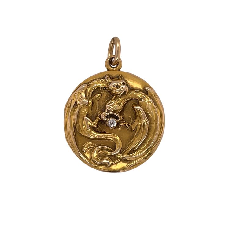 Art Nouveau 14K Yellow Gold Diamond Locket  The round repousse style locket depicting fitting griffins and is set with one small old mine cut diamond weighing approximately 0.05 carat total, measuring 1 1/8 inch and weighing 5.6 dwts. Circa 1900s Historical Yellow Gold Jewelry For Ceremonies, Historical Yellow Gold Jewelry For Ceremonial Use, Historical Yellow Gold Jewelry For Ceremonial Occasions, Historical Ceremonial Yellow Gold Jewelry, Historical Yellow Gold Wedding Jewelry, Historical Yellow Gold Jewelry For Wedding, Antique Finish Yellow Gold Round Jewelry, Historical Yellow Gold Engraved Jewelry, Historical Engraved Medallion Jewelry