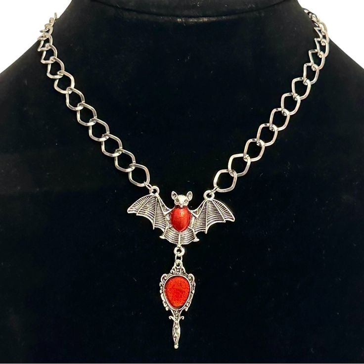 20% Off Bundles! New Without Tags. No Flaws. See Images For Details. Brand: Unknown Item: Necklace Shape: Bat Size: 15”-17” Drop: 2.75” Color: Silver Closure: Lobster Material: Silver-Tone Metal Please Ask All Questions Before Purchasing. Gothic Red Jewelry With Chain, Red Gothic Jewelry With Chain, Gothic Red Necklace With Chain, Gothic Red Chain Jewelry, Red Gothic Chain Necklace, Gothic Red Chain Necklace, Red Gothic Metal Necklace, Gothic Red Jewelry With Lobster Clasp, Red Gothic Jewelry With Lobster Clasp