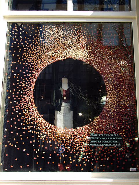 a display window with an image of a mannequin's head in the center