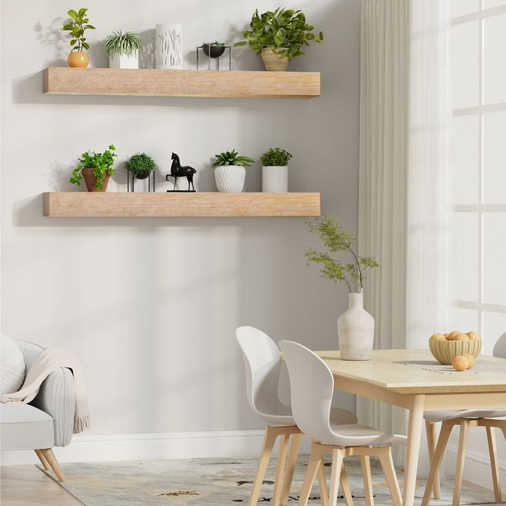 two wooden shelves with plants on them above a dining room table and chairs in front of a window