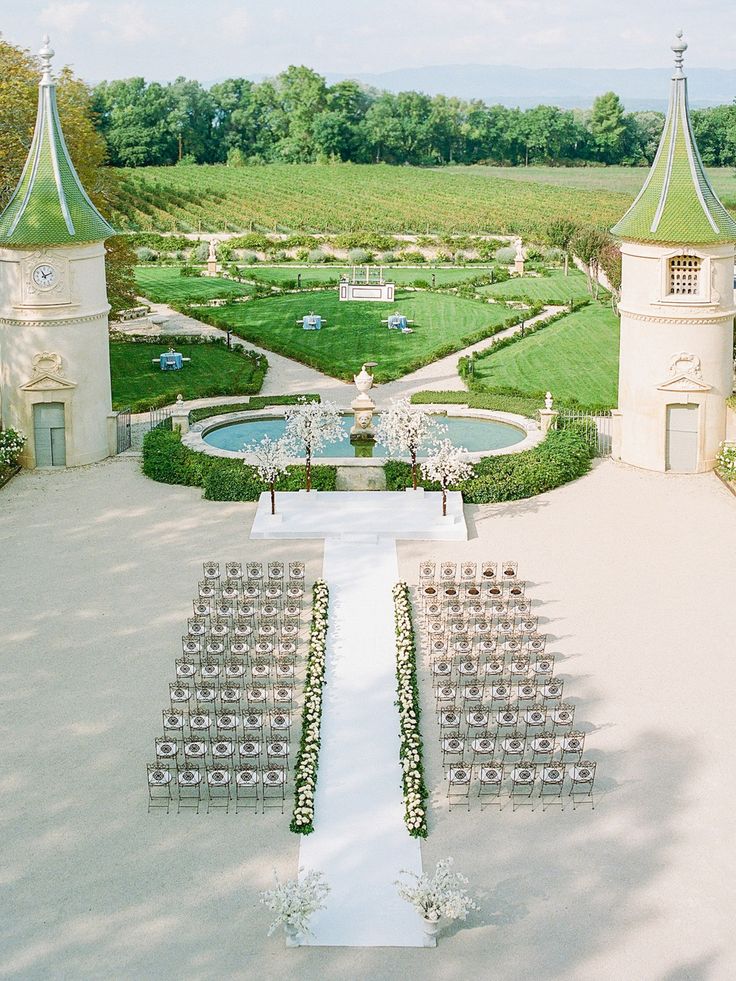 an aerial view of a wedding venue with rows of chairs set up for the ceremony