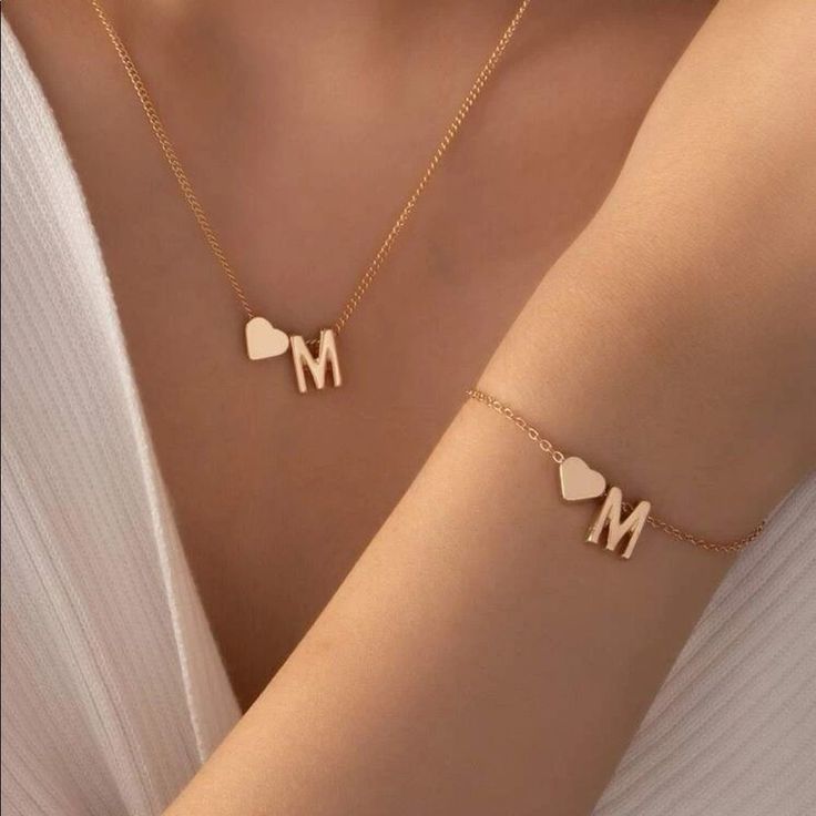 Letter M Matching. Necklace And Bracelet Set With Gold Heart New Size: Necklace: 15.7"-18.5" Bracelet: 5.9"-8.7" Metal: Alloy Color Gold Bin2 Elegant Gold Necklace, M Necklace, Bracelet Initial, Gold Bracelet Set, Long Statement Necklace, Letter Pendant Necklace, Initial Pendant Necklace, Fame Dr, Letter M