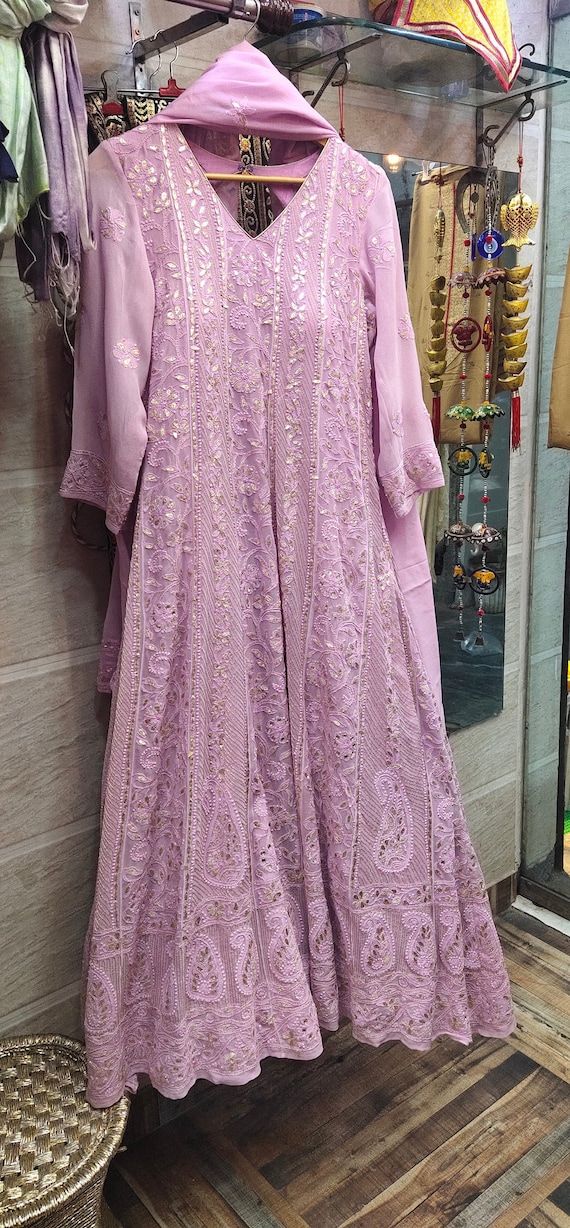 Check out this item in my Etsy shop https://www.etsy.com/listing/953657318/lucknowi-chikankari-anarkali-suit-hand Chikankari Georgette Suits, Chikankari Couple Outfits, Lucknowi Anarkali Dress, Lace Anarkali Suits, Lakhnavi Dress Pattern, Georgette Chikankari Anarkali, Lucknowi Chikankari Anarkali Suits, Lucknowi Anarkali Suits, Chikankari Frock Suit