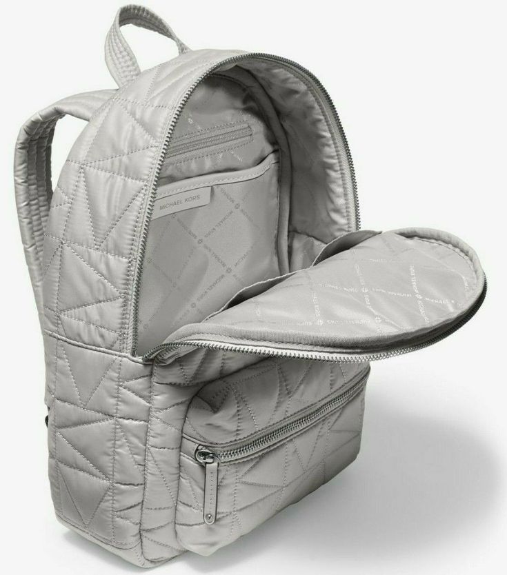 Michael Kors Winnie Medium Pearl Grey Quilted Nylon Backpack New with Tags & Gift Receipt; Authenticity Guaranteed! 35T0UW4B2C / Retail $398 Michael Kors Dust Bag Included Our Winnie backpack is defined by a quilted finish in a geometric take on the iconic MK initials. Padded shoulder straps provide day-long comfort, while a pocketed interior and front exterior compartment will safely store all the essentials. Wear it as a sport-luxe twist to any look. DETAILS • Backpack • Quilted • 100% polyest Gray Backpack, Sport Luxe, Kate Spade Outlet, Grey Backpacks, Quilted Backpack, Gunmetal Hardware, Medium Backpack, Exterior Details, Michael Kors Outlet