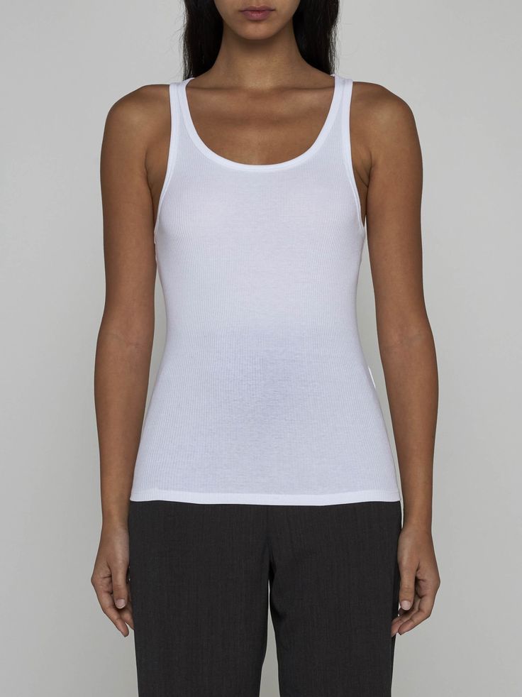 Filippa K's white ribbed knit stretch cotton tank top featuring a round neckline, racer-style and fitted silhouette. Composition: 95% cotton 5% elastane Classic Fitted Tank Top With Scoop Neck, Classic Fitted Scoop Neck Tank Top, White Stretch Crew Neck Tank Top, Classic Seamless Everyday Tank Top, Classic Everyday Seamless Tank Top, Fitted Knit Tank Top For Everyday, Fitted Tank Top For Everyday, Everyday Fitted Ribbed Tank Top, White Stretch Ribbed Vest