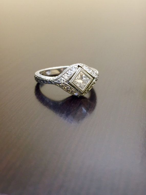 a diamond ring sitting on top of a wooden table