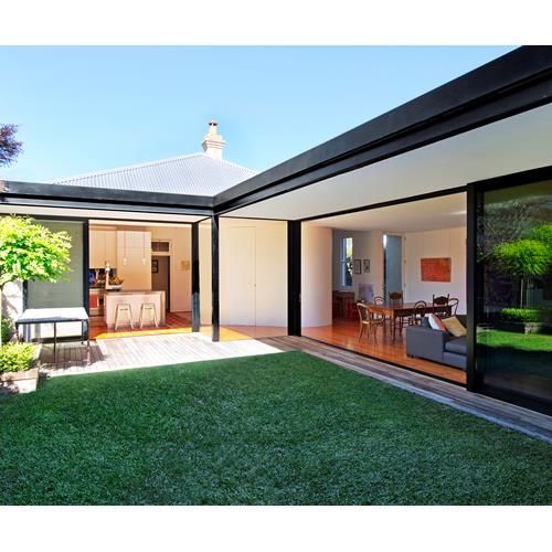 an image of a modern house with the text custom - designed, stacking doors create a perfect outdoor living space