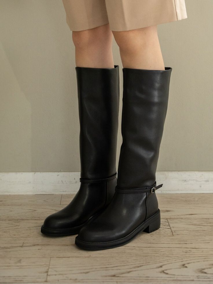 Editor's NotesWith sophisticated knee-high boots, you can walk in for miles, go-to for everyday denim looks, office outfitting, and party season.  - Side Buckle detail- Easy slip-on design- Luxurious look with genuine cowhide leather- Latex in sole for extra comfort Measurements(in.)- Size: KR 225MM (US 5.5) ~ KR 255MM (US 8.5)*Fits true to size.**For KR 240MM (US 7): Total Height 16.7 in. / Opening Circumference 15.7 in. / Ankle Circumference 12.2 in. Composition & Casual Knee-high Boots For Office, Denim Looks, Long Boots, Clothing Ideas, High Boots, Knee High Boots, Cowhide Leather, Walk In, Black Boots