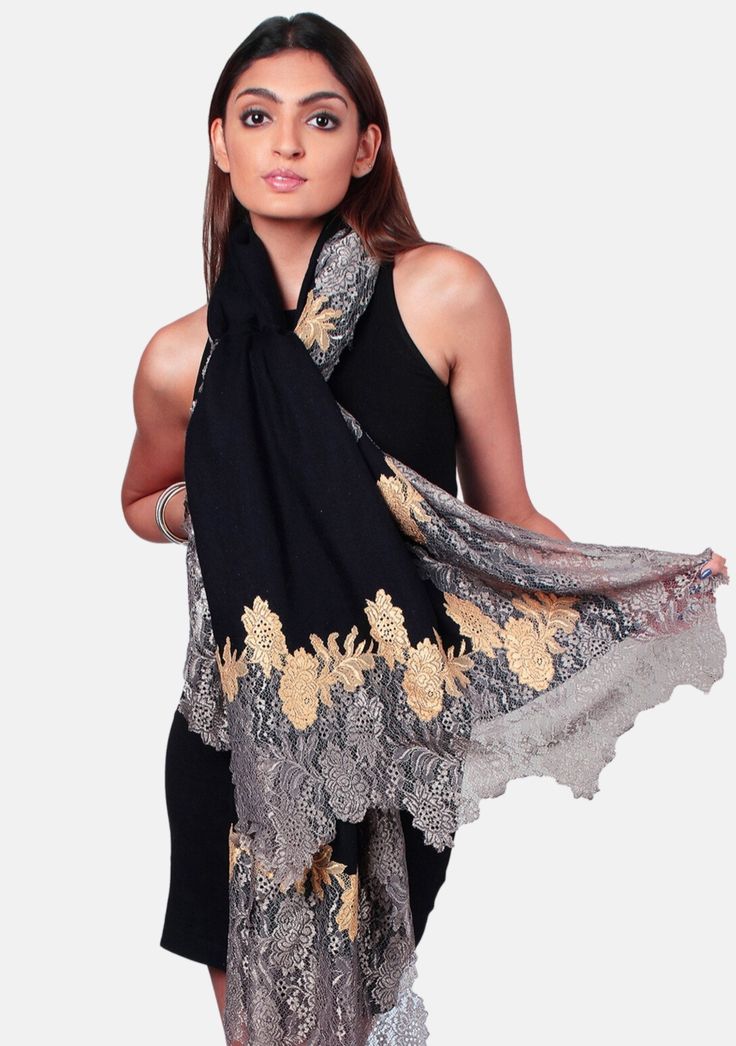 Crafted from a luxurious blend of wool and silk, this black scarf offers cozy warmth and sophistication. The stunning intertwined double-colored floral lace border in antique silver and dark gold creates a captivating visual contrast. Style yourself with this gorgeous accessory that epitomizes opulence whilst adding a touch of refined beauty to any evening out. Black Festive Pashmina Shawl, Black Pashmina Shawl For Festive Occasions, Elegant Black Pashmina Shawl For Winter, Elegant Black Pashmina Shawl For Formal Occasions, Black Pashmina Shawl For Wedding, Black Pashmina Shawl For Formal Occasions, Black Formal Pashmina Shawl, Formal Black Pashmina Shawl, Elegant Winter Festive Pashmina Shawl