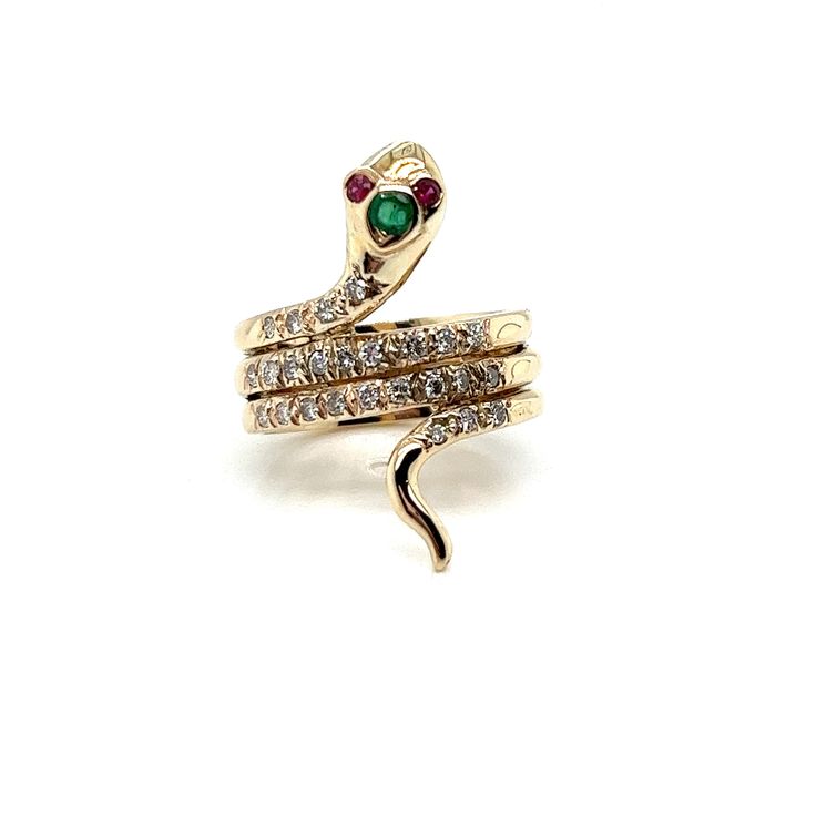 Vintage 14k yellow gold Diamond Snake Ring with Emerald and Rubies. The snake ring measures 1 inch from head to tail and the band measures 7.2mm wide. There are 25 round diamond set in the body of the snake and weigh about .40ct total. There is a 2.5mm green emerald set in the head and 2 1.6mm ruby eyes. The finger size is 6 3/4 and it can be sized upon request. The snake ring weighs 7.36g. Gold Snake Ring With Single Cut Diamonds, Gold Snake-shaped Diamond Ring, Gold Diamond Snake Ring Fine Jewelry, Gold Snake Ring With Diamond Accents, Gold Snake Ring With 17 Jewels, Gold Snake Ring With 17 Jewels, Fine Jewelry, Gold Snake-shaped Diamond Ring For Anniversary, Ring With Emerald, Emerald Set