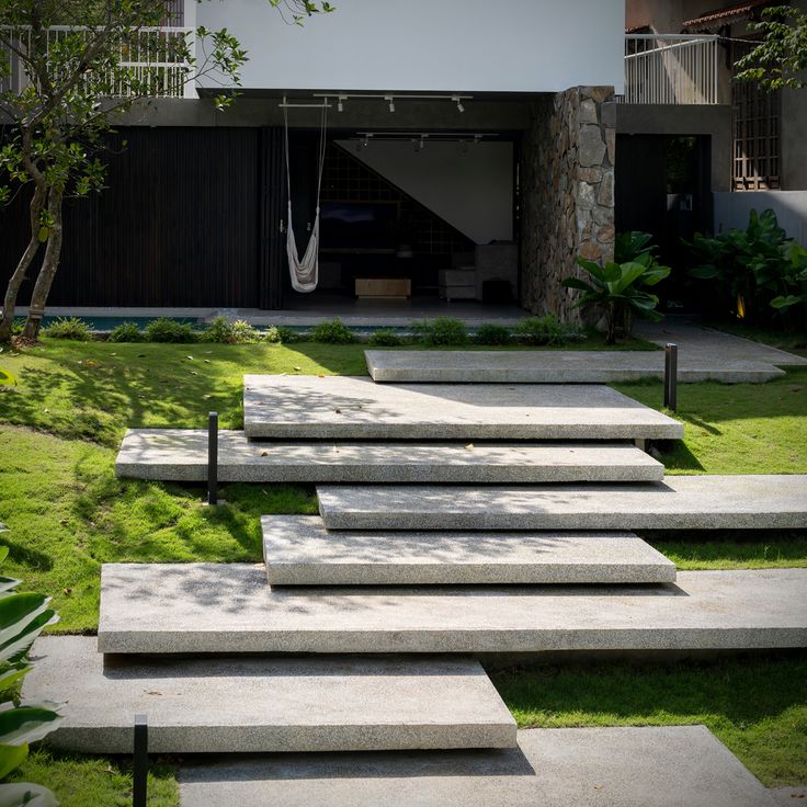 concrete steps leading up to a modern house