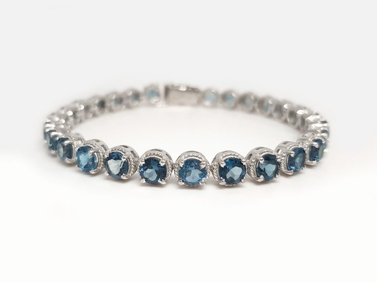 Genuine London Blue Topaz Tennis Bracelet in 925 Sterling Silver Gemstone : Genuine London Blue Topaz Metal used: 925 Sterling Silver Gemstone Shape : Round Width 5mm Gemstone Size     : 5 mm Weight : 16.25 Grams (For 7 Inches) ⦿ Payment Policy :- We accept payment through PayPal. ⦿ Shipping Policy :- * All Items will Be Carefully packed and Shipped Through UPS, Aramex, DHL eCommerce, India Post International, within 1- 2 Business Days from us. * 𝐀𝐥𝐥 𝐃𝐞𝐥𝐢𝐯𝐞𝐫𝐢𝐞𝐬 𝐰𝐢𝐥𝐥 𝐡𝐚𝐯𝐞 𝐎? Topaz Bracelet, Blue Topaz Bracelet, Bracelet Wedding, 925 Silver Bracelet, Adjustable Jewelry, Wedding Jewelry Bracelets, India Post, Gems Jewelry, London Blue Topaz