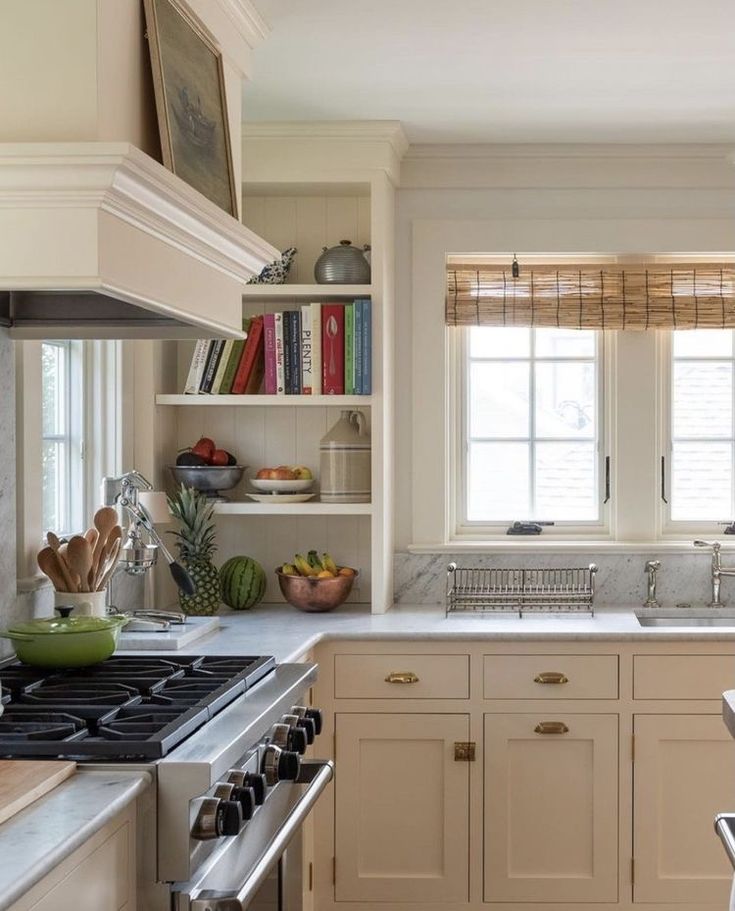 a kitchen with an oven, sink and stove top in it's center island