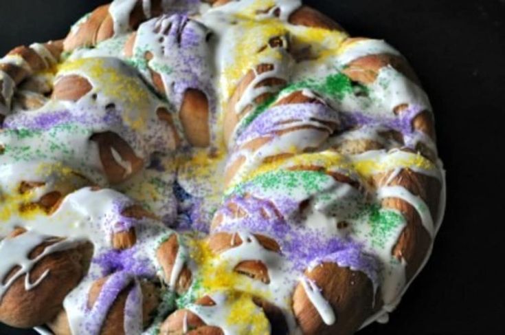 a bundt cake covered in icing and sprinkles