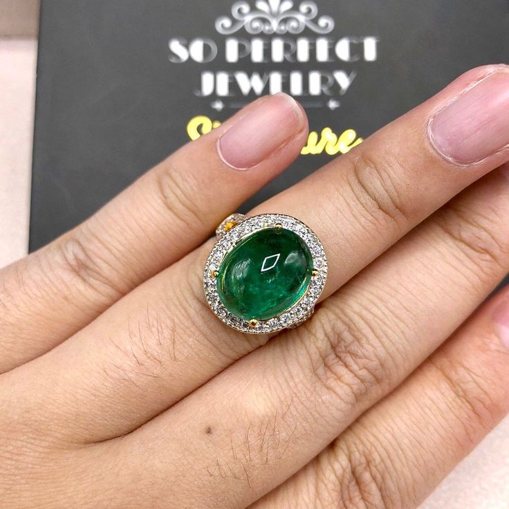 "ENJOY OUR WORRY-FREE SERVICE AND THE DAZZLING, GENUINE JEWELRY WE DESIGN AND HANDCRAFT WITH LOVE❤️ ABOUT THE ITEM: This ring is the perfect combination of elegance, beauty, and INVESTMENT VALUE! With a TRANSPARENT, 6.50 carats, VIVID FOREST GREEN emerald, and 52 extremely sparkling diamonds. The 18K yellow gold ring was deliberately designed and handcrafted by our boutique's in-house goldsmiths. You will love this gorgeous piece as much we do. And people will absolute adore it once they see the Luxury Yellow Gold Cabochon Diamond Ring, Luxury Emerald Cabochon Ring With Diamonds, Luxury 14k Gold Round Emerald Ring, Luxury Oval Emerald Ring In Yellow Gold, Luxury Oval Yellow Gold Emerald Ring, Fine Jewelry Emerald Diamond Cabochon Ring, Exquisite Oval Emerald Ring In Yellow Gold, Yellow Gold Diamond Cabochons Fine Jewelry, Luxury Emerald Cabochon Ring For Wedding