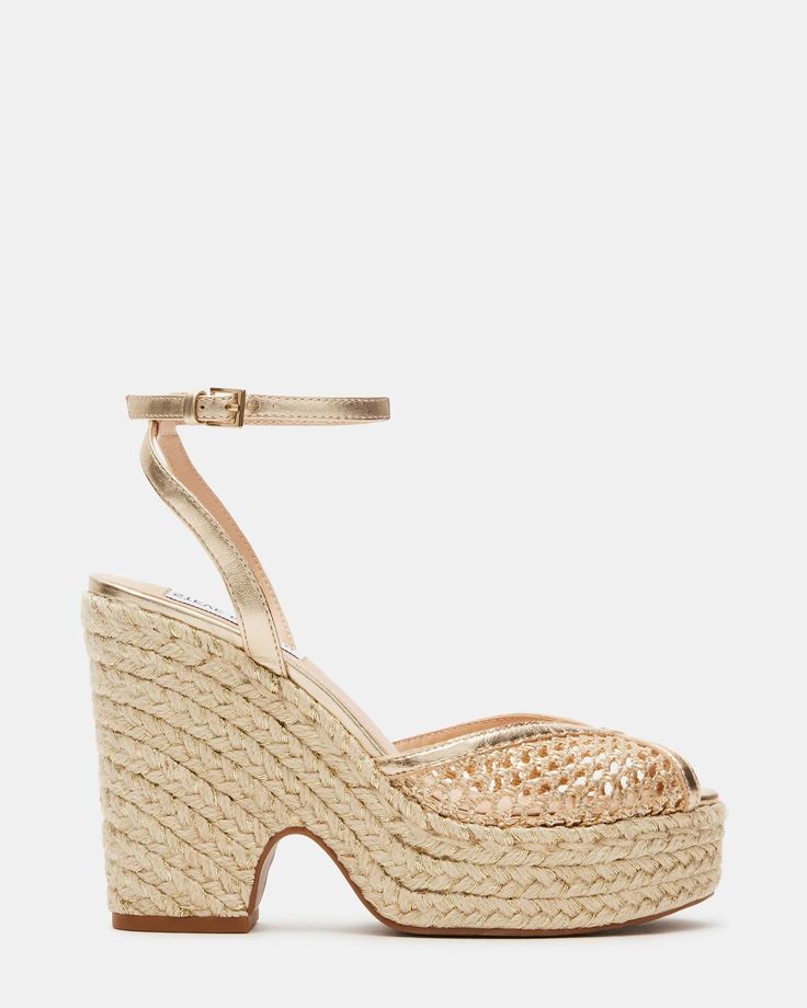 Introducing the SYDNEE platform espadrille sandal. This stylish sandal features a comfortable platform design that will elevate your look while providing all-day support. Perfect for any occasion, this shoe is sure to become your go-to summer shoe. 4.5 inch heel height 1.25 inch platform Raffia upper material Synthetic lining Synthetic sock Synthetic sole Imported