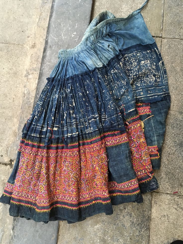 Vintage tribal Hmong handwoven hemp cotton skirt. Age is over 40 years and still very good condition. Textile,appliqué ,embroidery,batik are highly developed. This skirt is produced with all handmade,hand woven,hand dyed , hand sawing in silk,cotton threads. The batik pattern in cotton fabric,the embroidery pattern in hemp fabric Great to hang on the wall or any ideas. Measurements Length 63 cm Waist tie 60 cm-72 cm Weight 1030 grams Bohemian Long Skirt With Embroidery, Bohemian Cotton Bottoms With Multicolor Embroidery, Bohemian Festival Bottoms With Traditional Patterns, Traditional Cotton Skirt For Festival, Bohemian Skirt With Traditional Patterns For Festivals, Bohemian Embroidered Skirt For Festivals, Bohemian Long Embroidered Skirt, Traditional Patchwork Skirt For Festivals, Traditional Blue Cotton Skirt