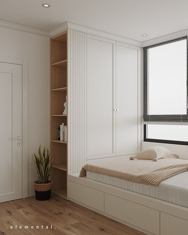 a bedroom with white walls and wooden flooring has a built in bookshelf