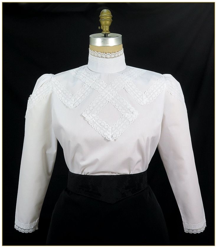 "Cotton/Poly. Color: White. Pima blend broadcloth fabric designed with raschel scalloped white lace trimmed design front. Button back stand up collar and full length gathered sleeves with white lace trim cuffs. Machine washable. Circa 1905-1910. Made in U.S.A. Sizes: SM, MED, LG & XLG. Blouses ordered by bust measurement, inches: BUST SIZES 32\" - 34\" SMALL 35\" - 39\" MEDIUM 40\" - 44\" LARGE 45\" - 49\" XLARGE Blouses ordered by bust measurement, centimeters: SMALL 81 cm - 86 cm MEDIUM 88 Lace Blouse Design, Broadcloth Fabric, Stand Up Collar, Victorian Women, Gathered Sleeves, Stripe Silk, Blouse Vintage, Dress Patterns, Womens Clothing Tops