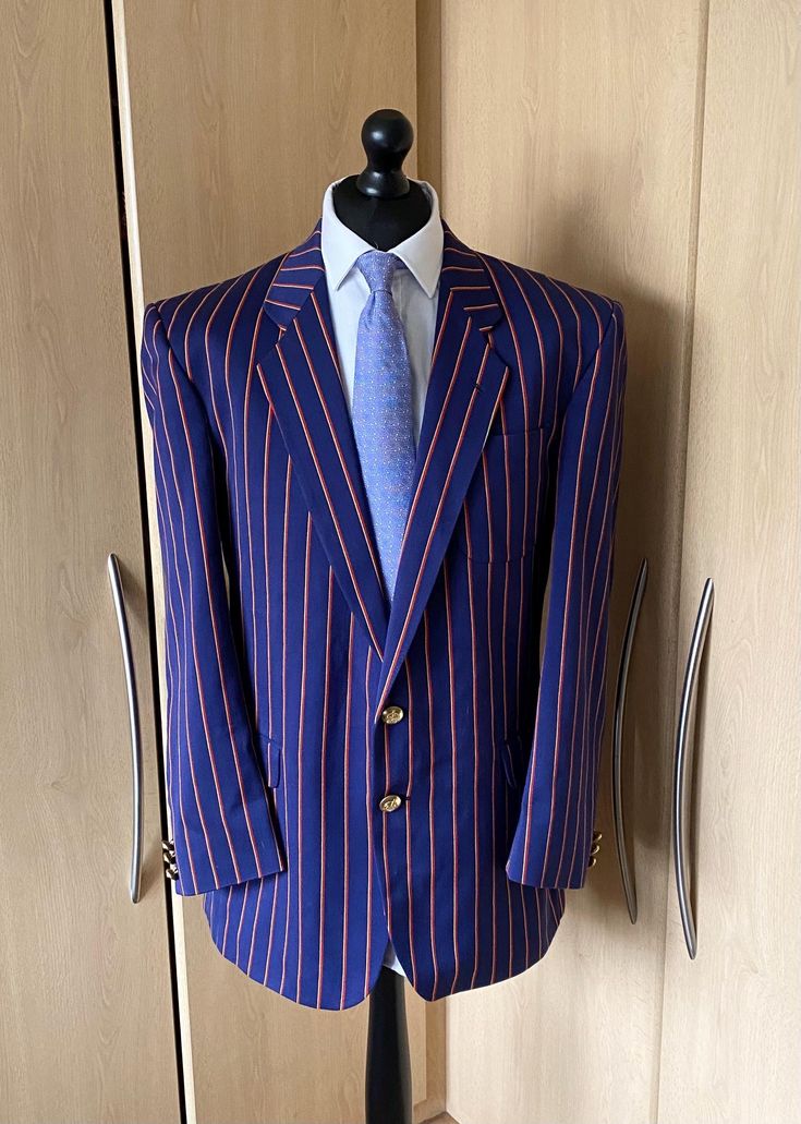 Up for sale is a stunning Mens blue striped ALEXANDRE boating  blazer jacket as shown in the pictures. The jacket is in superb used condition  The jacket is missing the size label but I would say it fits like a 46R and measures approx 24" armpit to armpit, 18" armpit to end of cuff, 21.5" shoulder to shoulder, 26" shoulder to end of cuff and 33" in length from the base of the collar. The jacket has two buttons on the front and two  vent split at the back Striped Long Sleeve Sport Coat For Formal Occasions, Pinstripe Single Breasted Long Sleeve Sport Coat, Long Sleeve Pinstripe Single Breasted Sport Coat, Pinstripe Single-breasted Long Sleeve Sport Coat, Striped Business Outerwear With Pockets, Business Striped Outerwear With Pockets, Striped Long Sleeve Sport Coat For Work, Striped Fitted Sport Coat With Long Sleeves, Size Label