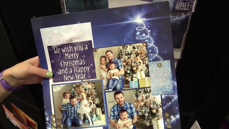 a person holding up a christmas card with photos on it