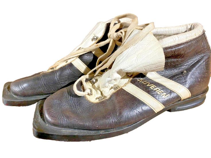 an old pair of brown and white shoes