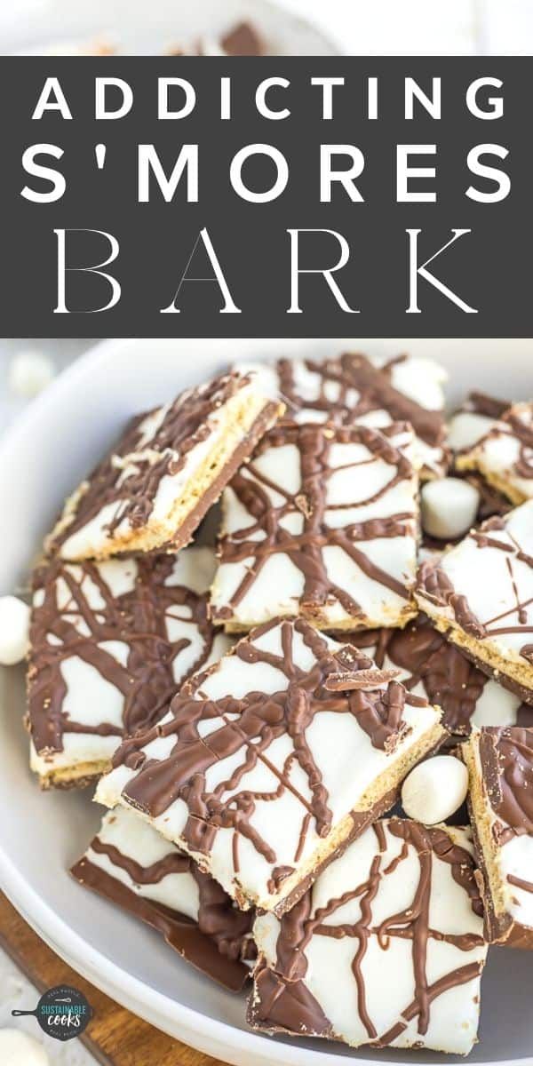 a white plate topped with chocolate covered marshmallows and text reading, adding smores to bark