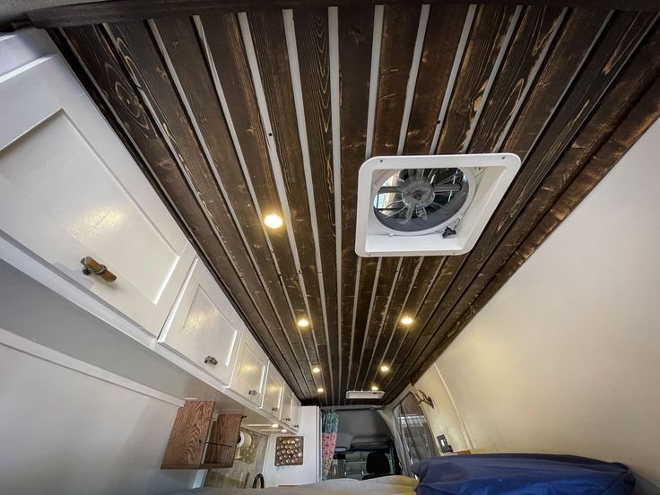 an air conditioner mounted to the ceiling in a room