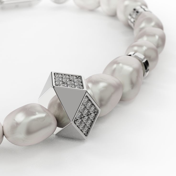 Complementing our stunning necklace, this exquisite bracelet features a harmonious blend of the finest river pearls and a custom-designed stainless steel chain. The unique design alternates between lustrous pearls and sleek steel links, mirroring the elegance of the necklace. Our logo is elegantly engraved on the chain, adding a distinctive touch of branded luxury. Available in three sizes S, M, and L the bracelet offers a perfect fit for any wrist. Wear it alone or paired with the matching neck Luxury Pearl Bracelet With Charm, Luxury Metal Pearl Chain Necklace, Luxury Pearl Necklace With Metal Chain, Modern Silver Pearl Chain Necklace, Luxury White Gold Pearl Oyster Bracelet, Modern Silver Pearl Bracelet For Formal Occasions, Modern Beaded Bracelets For Formal Occasions, Modern Silver Pearl Bracelet With Oyster Design, Modern Jewelry With Pearl Charm