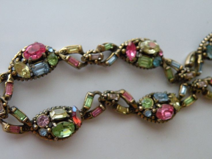 "Hollycraft necklace and clip-on earrings. Necklace unmarked, approximately 16 1/2\" long with hook clasp x 1/2\" wide. Earrings marked Hollycraft. Hollycraft copr 1955. Size: 1\" x 3/4\" Very good vintage condition." Vintage Multicolor Multi-stone Jewelry, Retro Multicolor Jewelry With Matching Earrings, Vintage Multicolor Jewelry With Matching Earrings, Vintage Multi-stone Multicolor Jewelry, Multicolor Clip-on Jewelry For Wedding, Multicolor Retro Jewelry For Wedding, Retro Multicolor Jewelry For Wedding, Multicolor Clip-on Wedding Jewelry, Retro Pink Jewelry For Formal Occasions