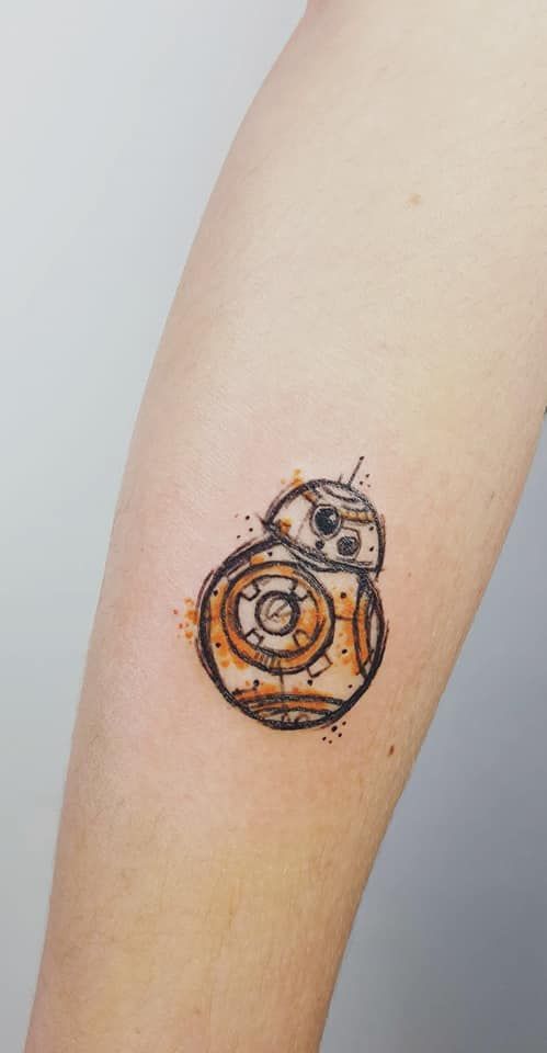 a star wars bbg tattoo on the arm