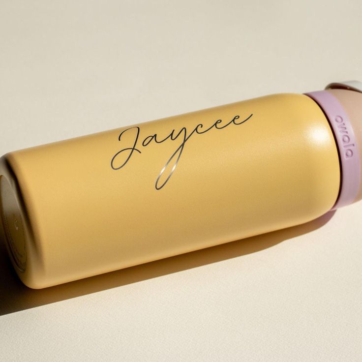 a close up of a tube of lipstick on a white surface with the word jaquee written on it