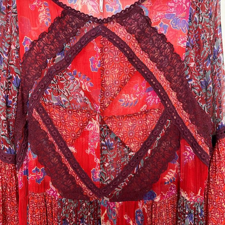 Free People Field of Dreams Maxi Dress Sheer Bell Sleeves. Long sleeve maxi dress with flowy sheer fabric. Boho printed design in shades of red and purple. Crochet lace details. Would make a perfect coverup, vacation dress, festival look, or layered over denim! This dress is sheer and comes unlined, no slip underneath. Women's size Medium MSRP $198 Approximate measurements with the garment laying flat: Pit to pit: about 20.5 inches Length: about 48 inches Bohemian Sheer V-neck Maxi Dress, Flowy Maxi Dress With Lace Patchwork, Flowy V-neck Maxi Dress With Lace Patchwork, Sheer Flowy Bohemian Maxi Dress, Flowy Sheer Bohemian Maxi Dress, Bohemian Maxi Dress With Lace Sleeves, Bohemian Sheer Floor-length Dress, Bohemian Floor-length Sheer Dress, Flowy Long Maxi Dress With Lace Trim