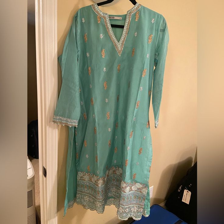 Cotton Silk Shirt With Semi Formal Embroidery. Pants, Kurta, And Dupatta. Size 12/Medium Bust Is 22 Inches Blue Long Sleeve Kurta With Gota Work, Spring Salwar Kameez With Gota Work And Long Sleeves, Traditional Green Pant Set With Resham Embroidery, Spring Long Sleeve Salwar Kameez With Gota Work, Bollywood Style Kurta With Gota Work For Spring, Green Embroidered Pant Set For Eid, Spring Semi-stitched Salwar Kameez With Gota Work, Semi-stitched Salwar Kameez With Gota Work For Spring, Bollywood Salwar Kameez With Gota Work For Spring