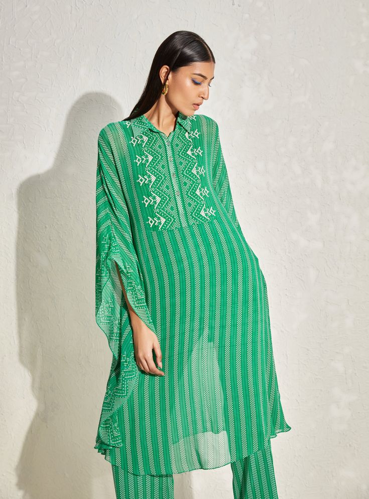 Editor's Note This set features an Aster stripes kaftan with matching pants and slip, adorned with geometric hand embellishments. Color: Green Fabric: Georgette Component: Kaftan, slip and pant Occasion: Daywear Disclaimer: Product color may slightly vary due to photographic lighting sources or your monitor setting. Care: Dry clean only About the Designer Namrata Joshipura's design vision is global and transcends boundaries of geography, age, race, and point of view. Her clothing blends contempo Green Kaftan, Kaftan Set, Pant Set For Women, Color Pairing, Matching Pants, Pant Set, Green Fabric, Kelly Green, Set For Women